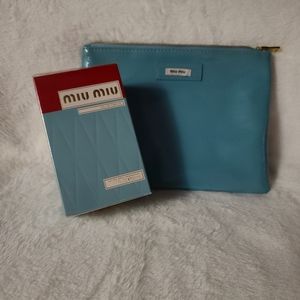 Miu Miu 50ml EDP spray, sealed, comes with makeup case.